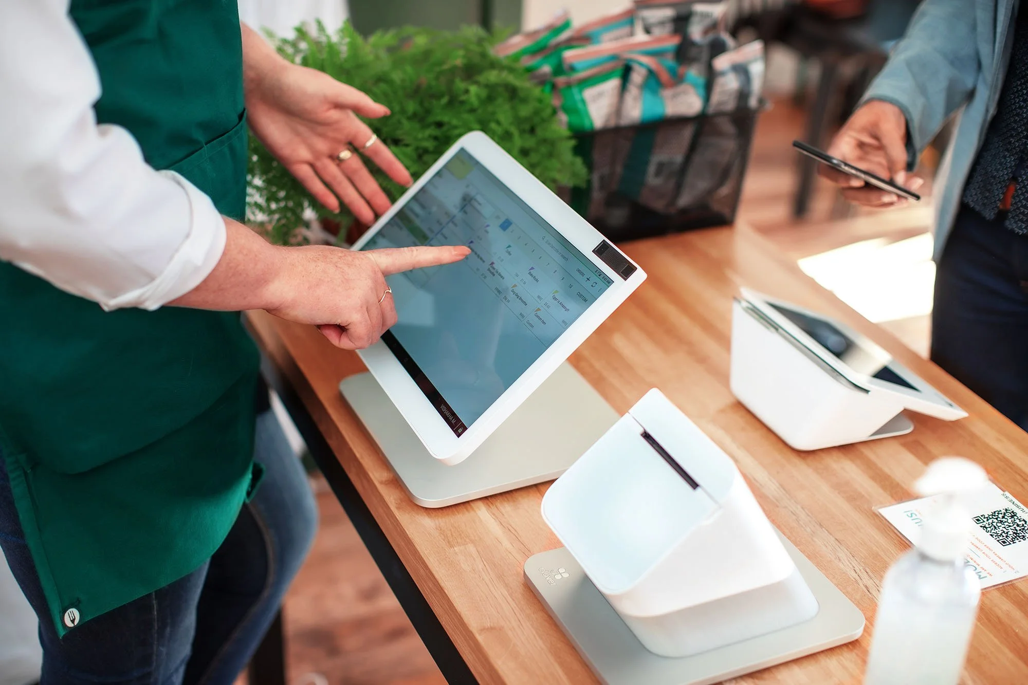 A business owner using a Welsync tablet POS