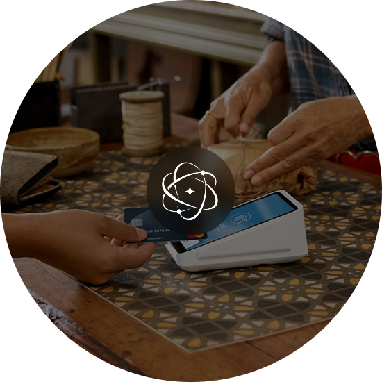 A customer paying by card at a market stall